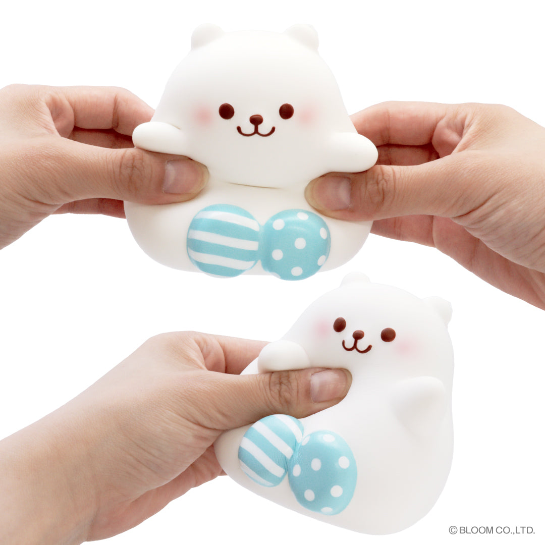 Marshmallow Bear Marmo – White, being squeezed in hand