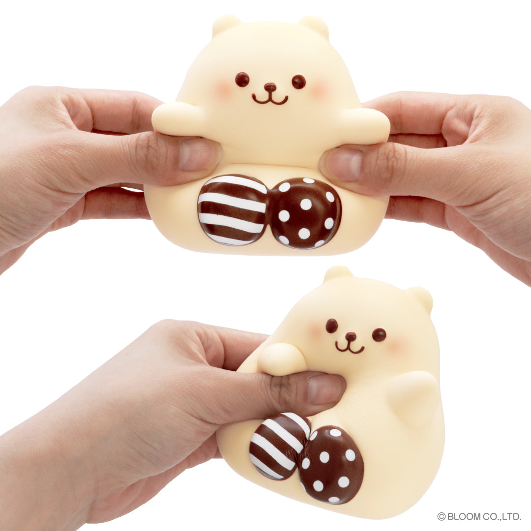 Marshmallow Bear Marmo – Chocolate, being squeezed in hand